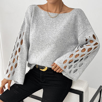 Tyra – modny, elegancki damski sweter z dekoltem w kształcie litery V i ażurowymi rękawami